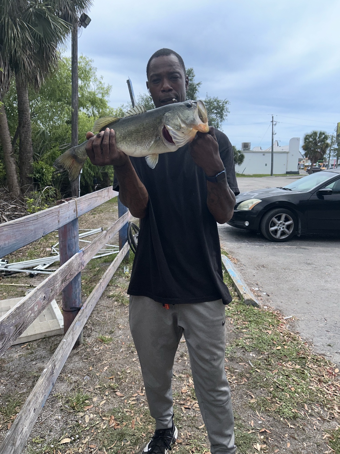 Angler holding a large bass